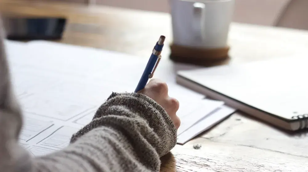 Structured daily energy inventory and sensory tracker journal on a quiet desk